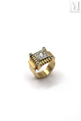 a close up of a gold ring with diamonds on a white background