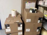several boxes of toilet paper stacked on top of each other in a store