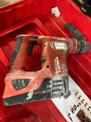 a red tool in a red box with a hammer in it