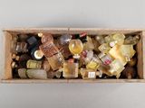 a wooden box filled with bottles and bottles of alcohol