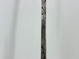 a close up of a metal object on a wooden stand