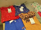 a lot of clothes that are on a table