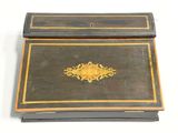 a black box with a gold decoration on it