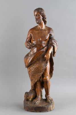 une image représentant la statue d'un homme tenant un chien dans ses bras