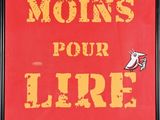 a picture of a red and yellow sign that says travailler moins pour lire plus