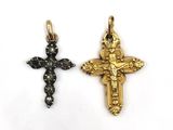 two gold and black diamond cross pendants