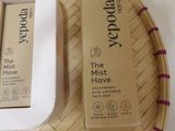 two boxes of the mist have been placed on a bamboo tray