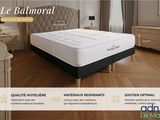 the bed is made of wood and has a mattress on it