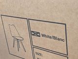 packaging of a box with a white chair and a black chair on it
