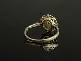 an image of a gold ring with a diamond