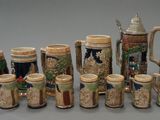 a lot of beer mugs that are lined up together