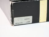 a black box with a yellow stripe on it