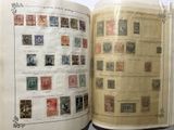 an open book with a lot of stamps on it