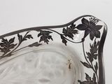 a glass bowl with a black and white design on it
