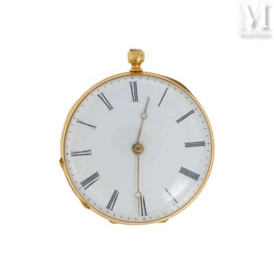 a gold pocket watch with roman numerals on the face