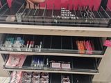 a display of makeup products for sale in a store
