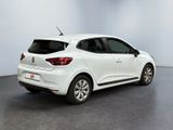 the rear end of a white car in a white room