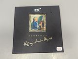 an album with a picture of a man sitting at a desk