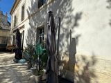an image of a patio with an umbrella and potted plants