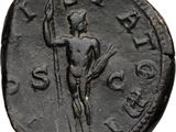a close up of a coin with a statue on it