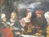 une peinture représentant un groupe de personnes assises autour d'une table