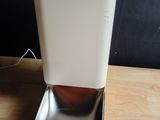 a water dispenser sitting on a wooden table