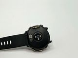 a watch that is sitting on a white surface