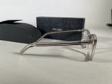 a pair of glasses sitting on a table next to a pair of glasses