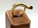 a wooden box with a ring on top of it
