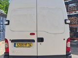 a white van that is parked in a lot