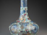 a blue vase with a floral design on it