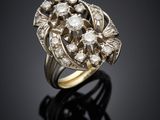 a gold and diamond ring, by business