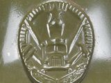 a close up view of a green fire hydrant with a coin on it