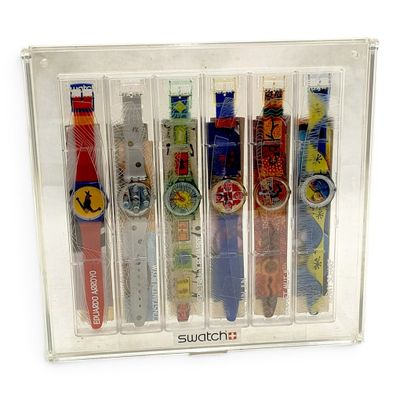 five different colored watches in a clear display case