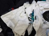 a pile of clothes that is sitting in a suitcase