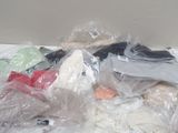a pile of clothes that is sitting on a table