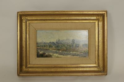 une image représentant un tableau représentant une ville, dans un cadre doré