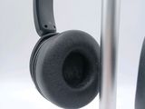 a pair of headphones that are on a stand