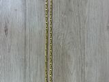 a gold necklace with a chain that is attached to it