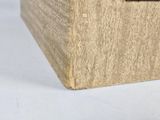 a close up of a wooden box on a white surface
