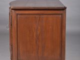 an old wooden cabinet with a drawer on top of it