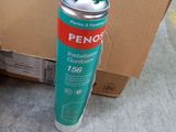 a can of peno on the ground next to a cardboard box