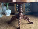 a wooden table with a glass door in the background