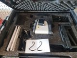 a case that has a gun and other items in it