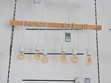 a white wall with a bunch of items hanging from it