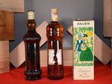 two bottles of wine sitting next to each other on a table