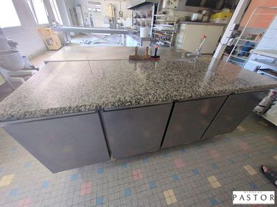 a picture of a kitchen with a large counter top