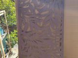 an image of a metal screen with a leaf design on it