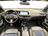 the interior of a bmw car with a steering wheel and dashboard