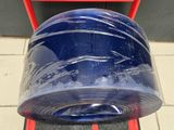 a picture of a roll of blue tape sitting on top of a red chair